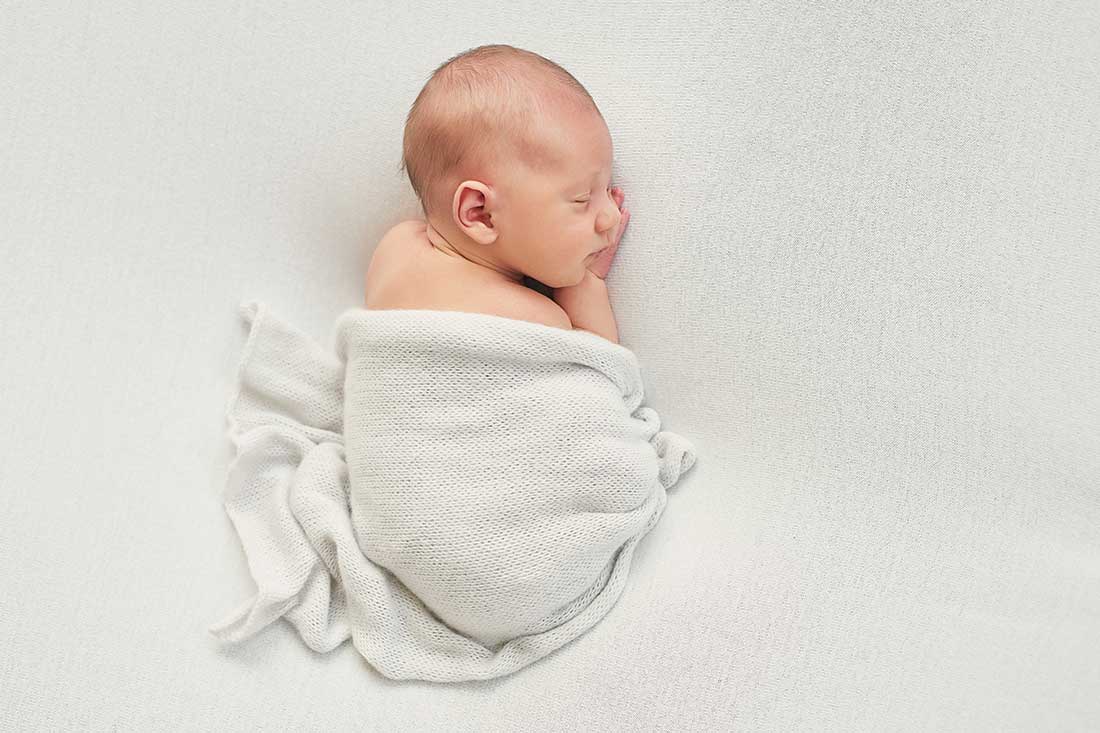 Hoe gebruik je een baby swaddle?